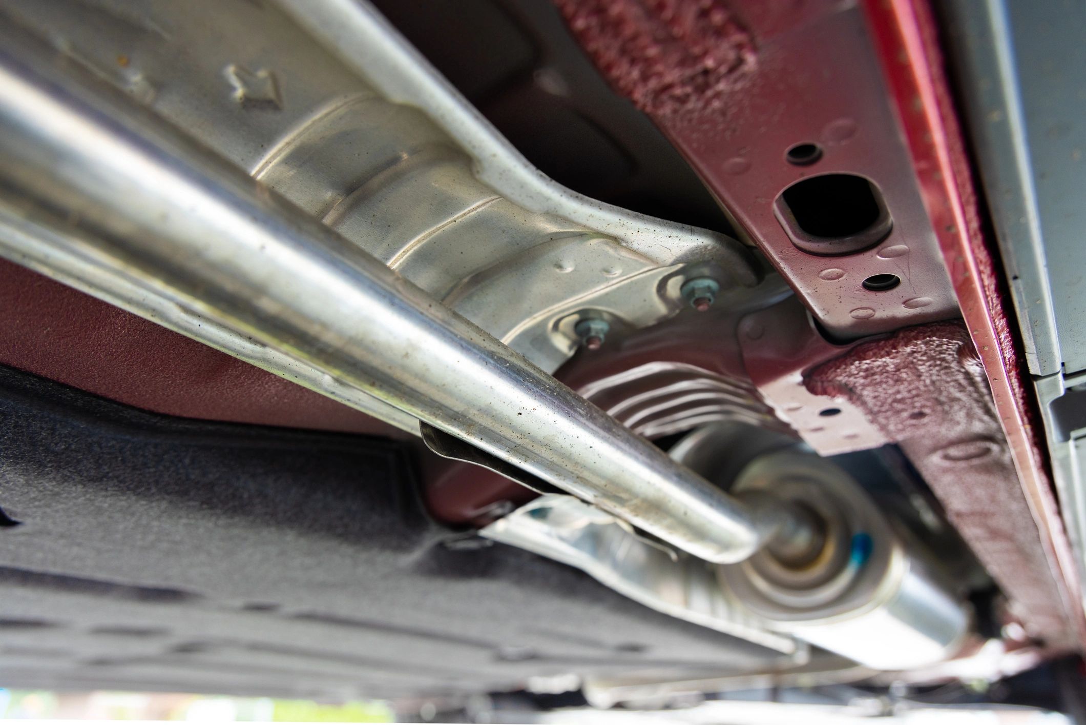 Exhaust pipe under a vehicle during inspection