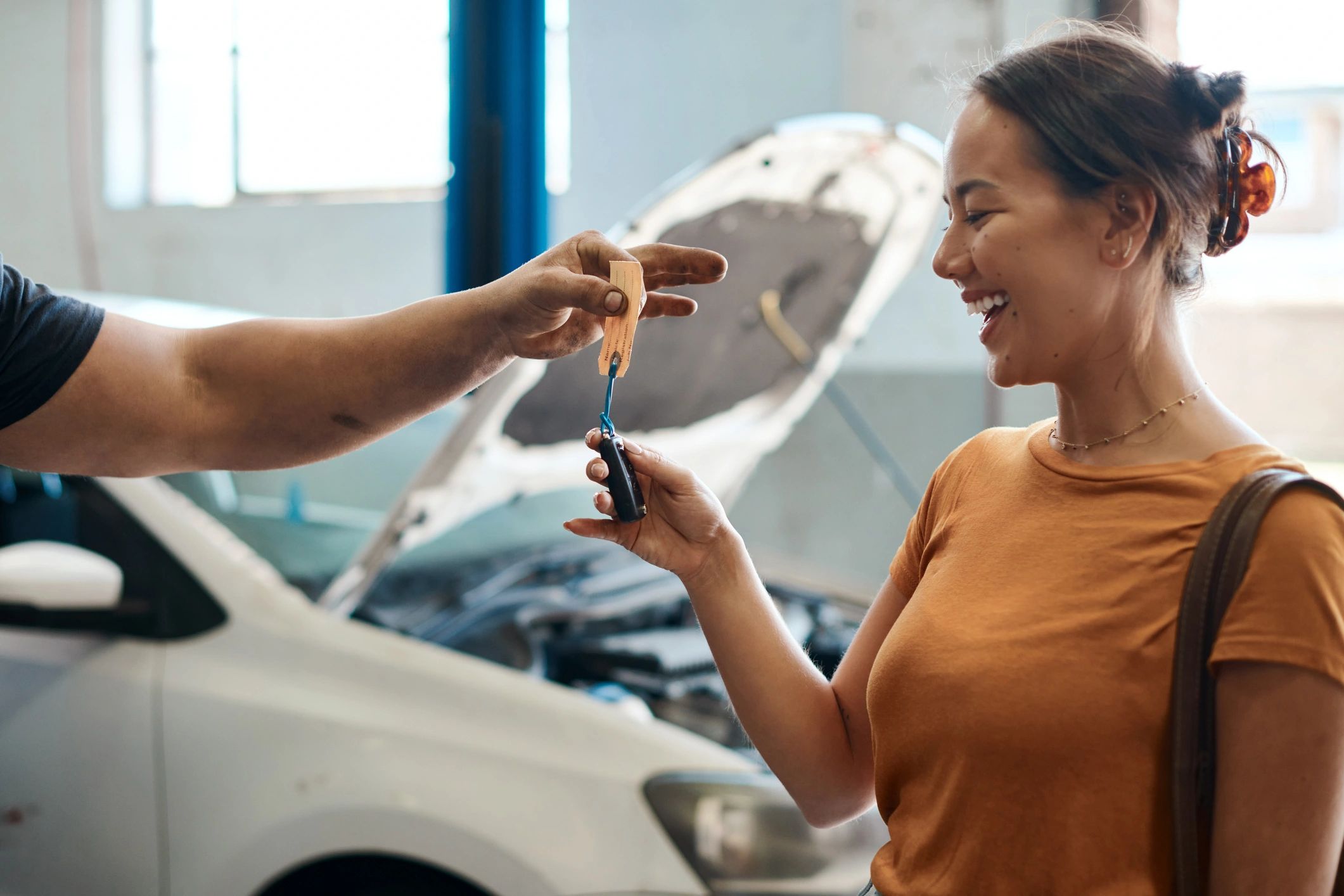 Customer receiving car keys after service